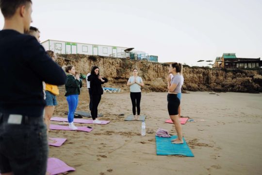 beach yoga with yoga teacher surf camp