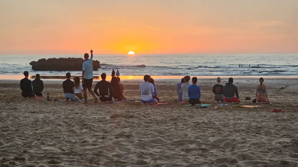 Evening yoga session on the beach in Morocco