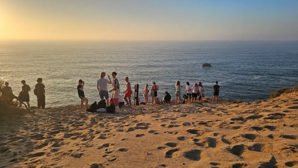 Surf camp group enjoying sunset in Morocco