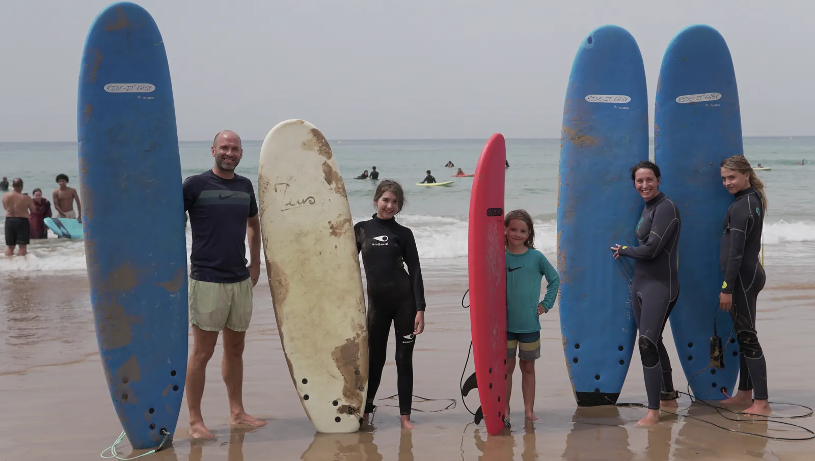 family surf lesson soft boards taghazout beach Taghazout Surf Camp