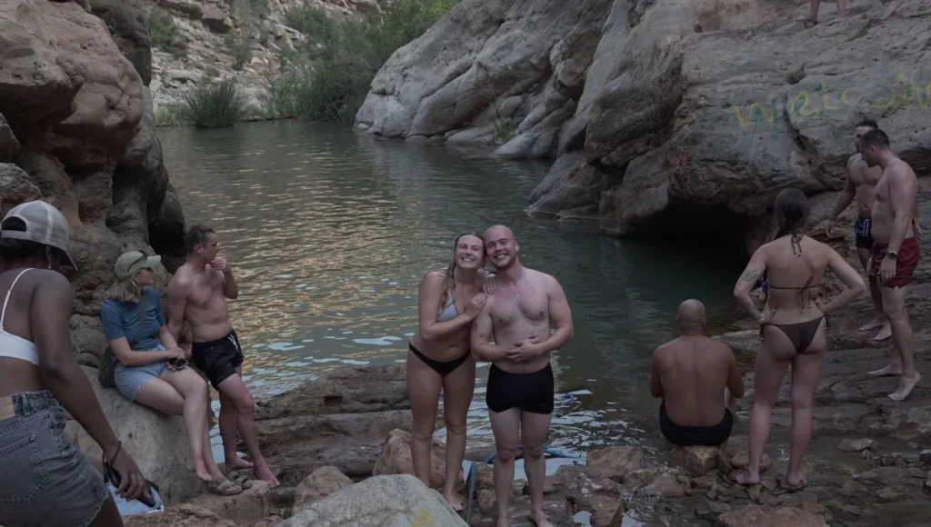 Surf camp guests by the rock pool in Paradise Valley